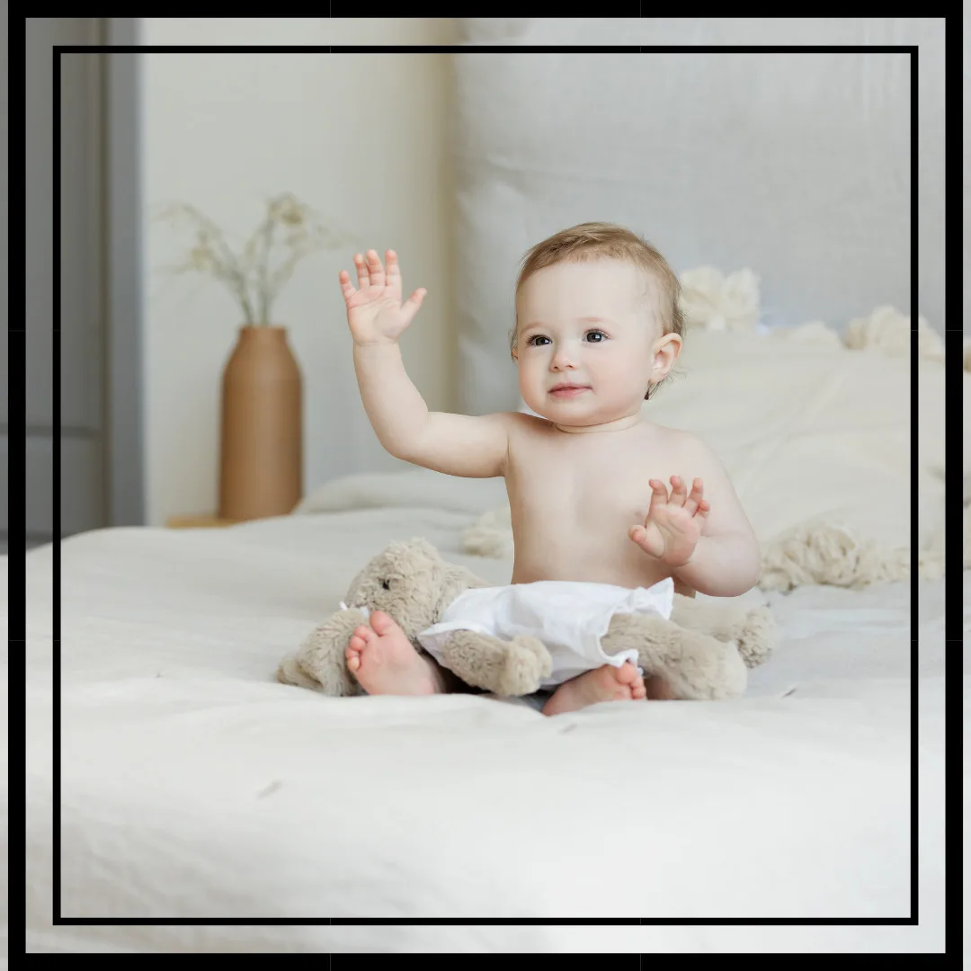 Beautiful Baby Images With Quotes/Adorable Baby Sitting On The Bed