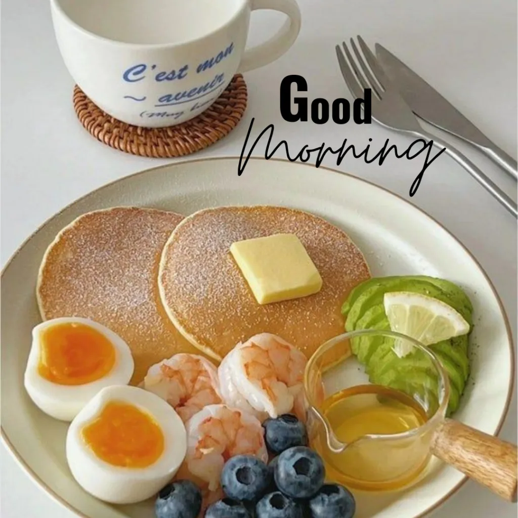 Good Morning Breakfast Image / image of pancake with butter and honey, eggs, avocado and blueberries 